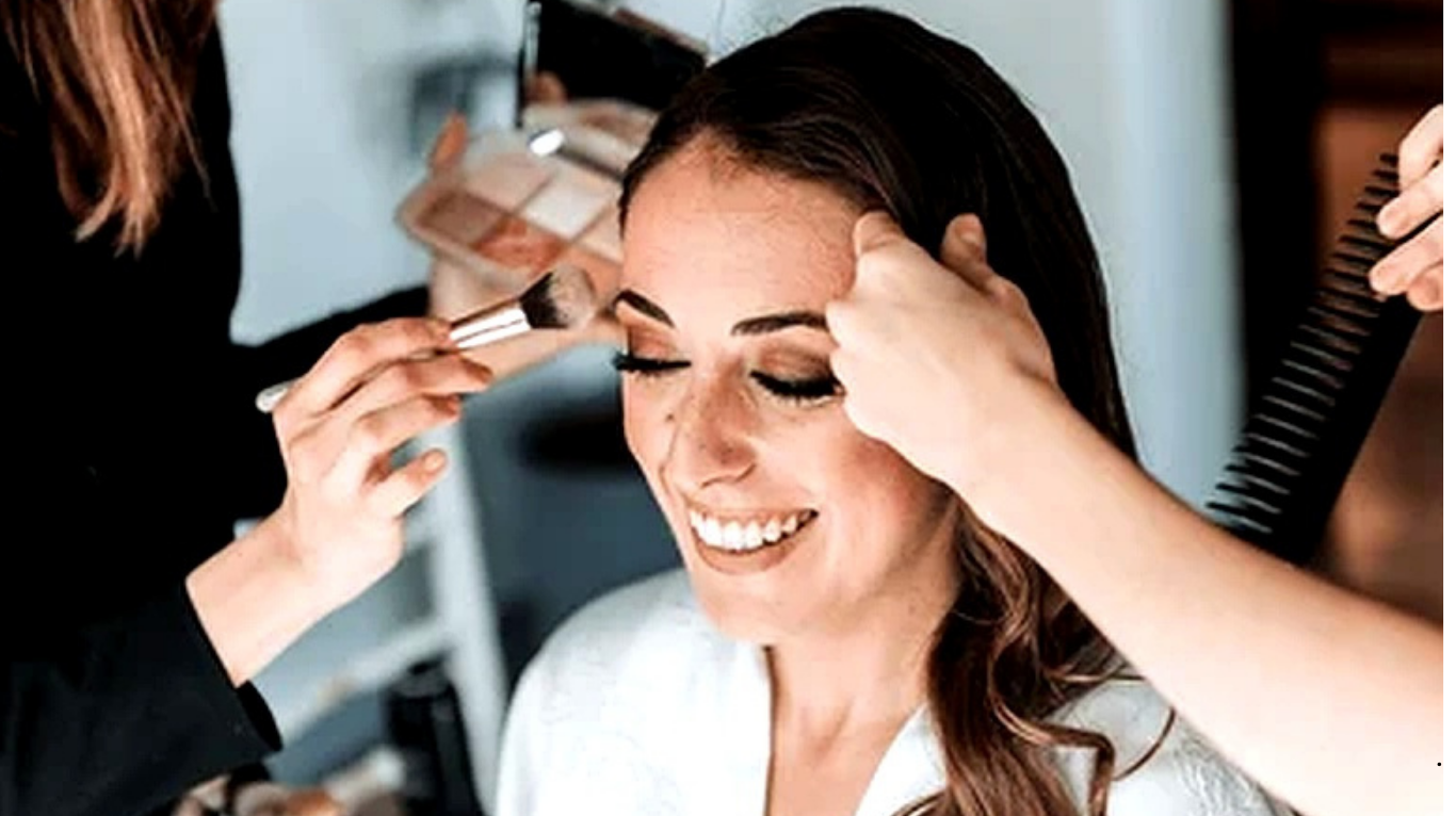 Bridal makeup artist applying foundation for long-lasting wedding makeup
