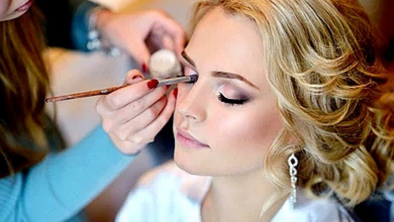 Makeup artist applying foundation