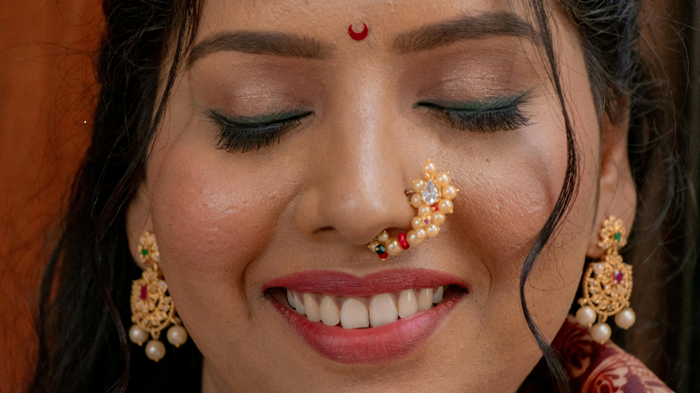 Bridal makeup artist creating airbrush makeup look