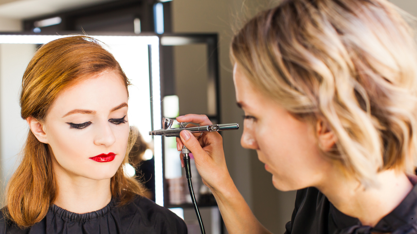 Professional airbrush makeup artist at work