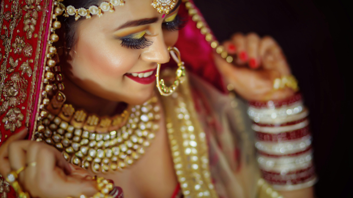 Traditional bridal makeup with bold eyes and red lips