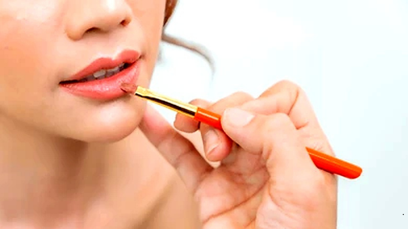 Professional bridal makeup artist applying HD makeup on bride