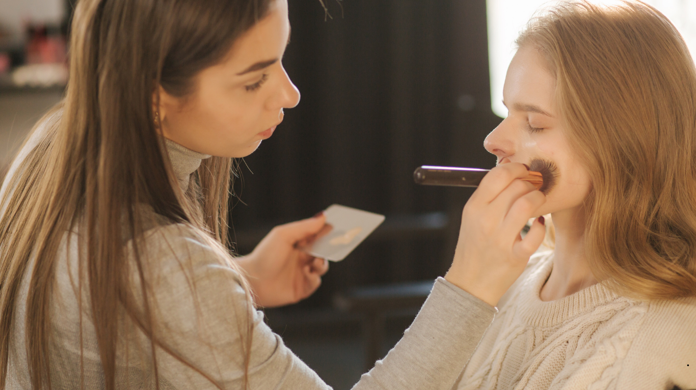 Certified makeup artist creating a flawless look
