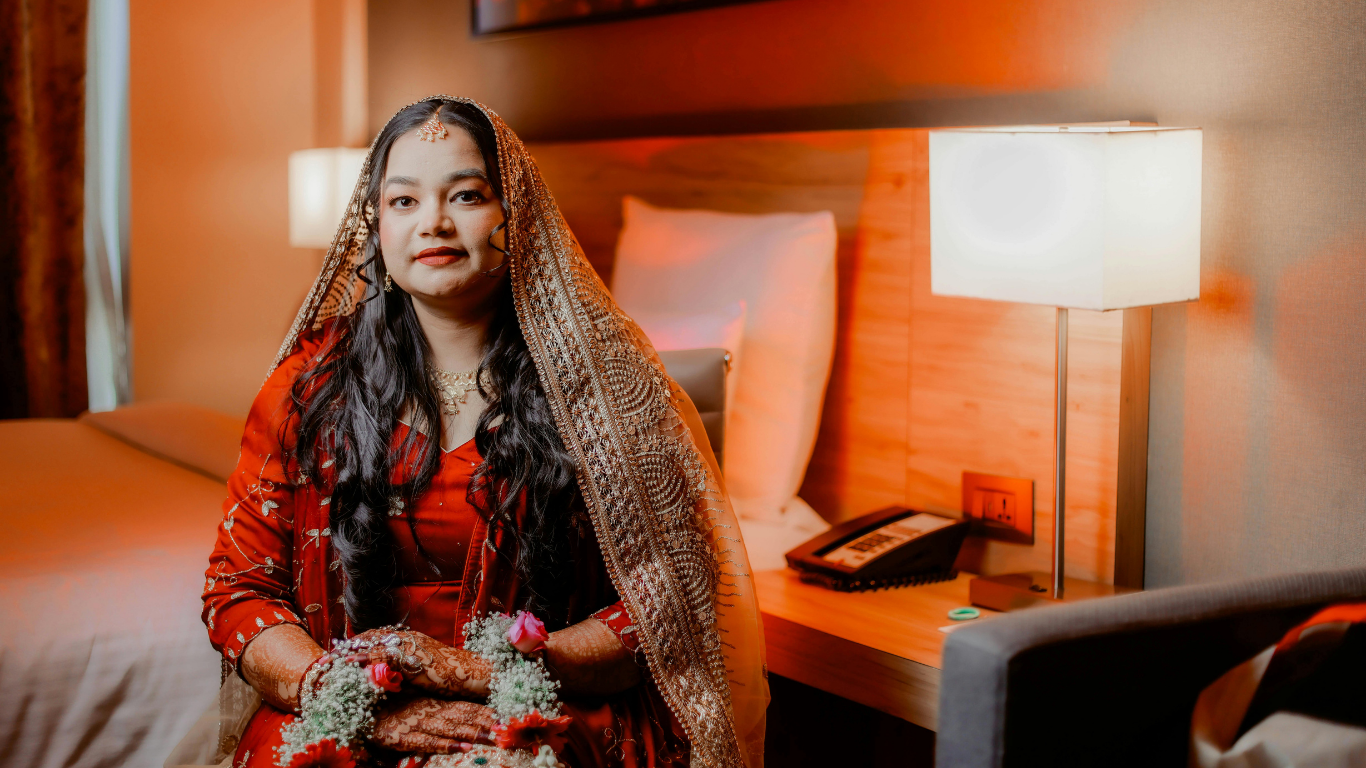 Bridal makeup artist styling bride for wedding ceremony