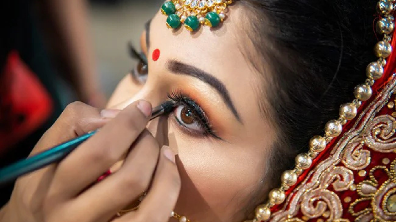 Makeup artist in professional studio setup